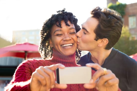 Young couple taking selfie